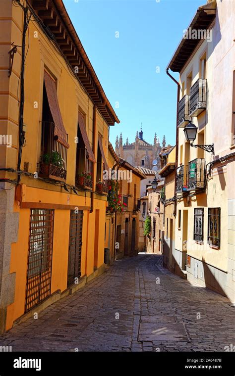 Traditional old Spanish street, in the historic city of Toledo, Spain ...