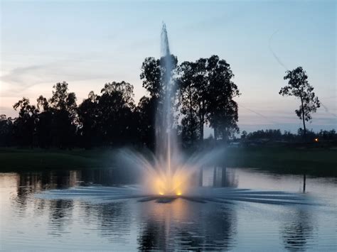 This is a closeup of our Stainless Steel Pro Series 2 HP Lake Fountain lighted with warm white ...