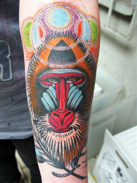 Beautiful calm baboon head tattoo on arm - Tattooimages.biz