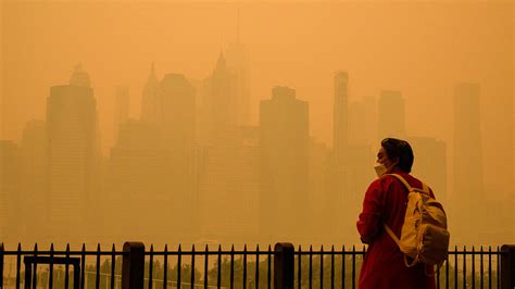 In pictures: Smoke from wildfires turns North American skies orange ...