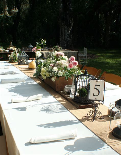 Feasting tables of ivory linen and burlap; vintage tablescapes of flower boxes, birdcages, mason ...