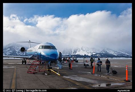 Picture/Photo: Passengers boarding aircraft, Jackson Hole Airport, winter. Grand Teton National Park