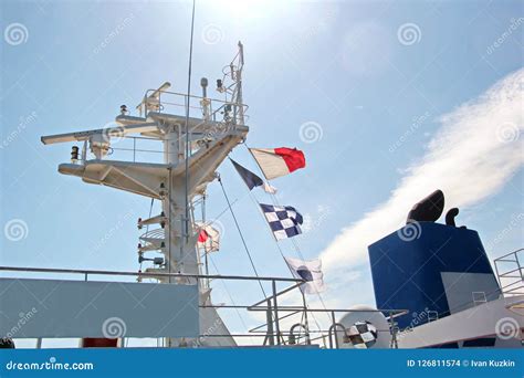 State Flags Raised on the Mast of a Merchant Ship in the Ports of Call. Stock Photo - Image of ...