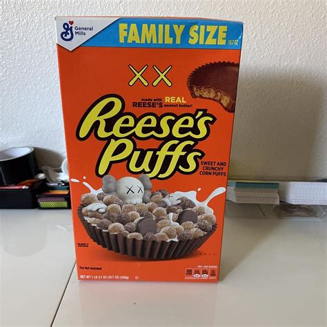 KAWS Reese’s Puffs - Depop