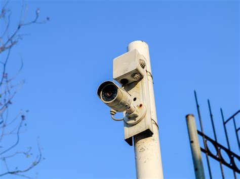 Premium Photo | Cctv camera installed on a pole in an outdoor park