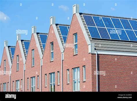 Modern Dutch houses with solar panels on roof Stock Photo - Alamy