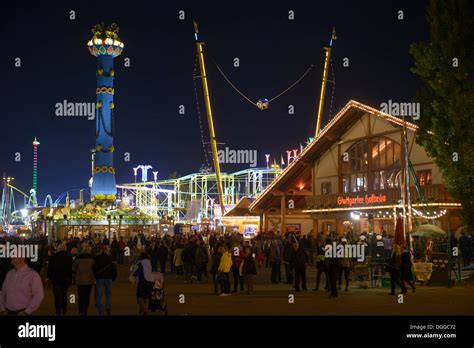 View of the Cannstatter Volksfest fair, rides, funfair, beer tents, people with the Fruit column ...