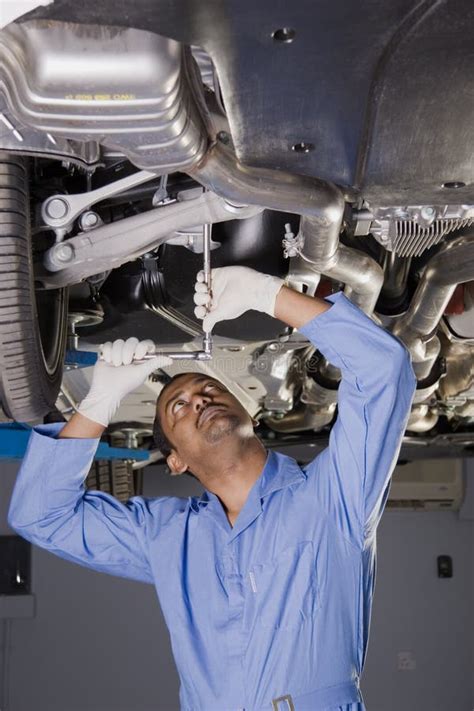 Auto mechanic under car stock photo. Image of transmission - 4016162