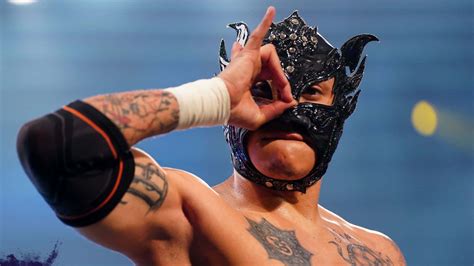 Download Rey Fenix Wrestler All Black Mask Wallpaper | Wallpapers.com