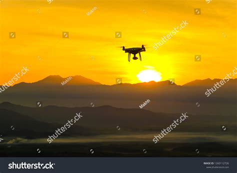 Silhouette Drone Flying On Mountain Sunset Stock Photo 1260112726 | Shutterstock