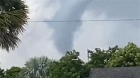 Two-minute tornado hits Miami bringing hailstones in its wake | Sky News