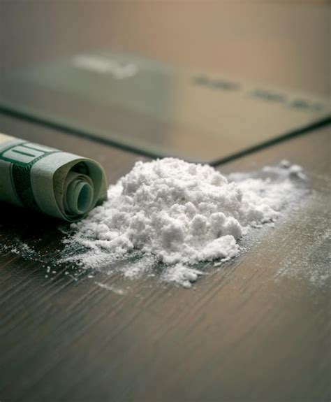 Premium Photo | Cocaine powder on the table