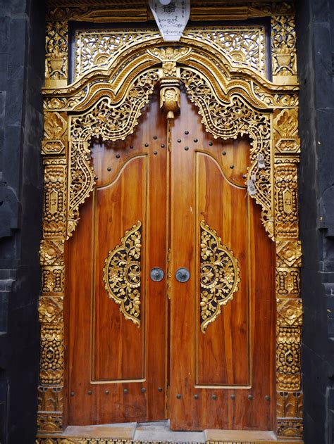 9 Breathtaking Wood Carving Door Designs For Indian Homes