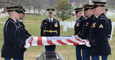 Who places flags at Arlington National Cemetery for Memorial Day?