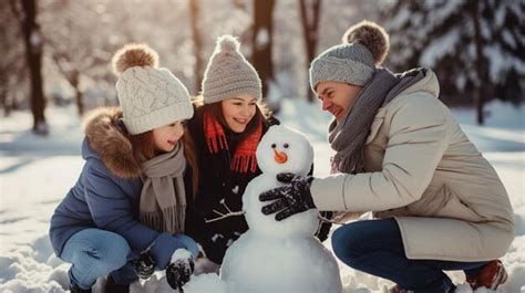 Premium AI Image | a family building a snowman at park