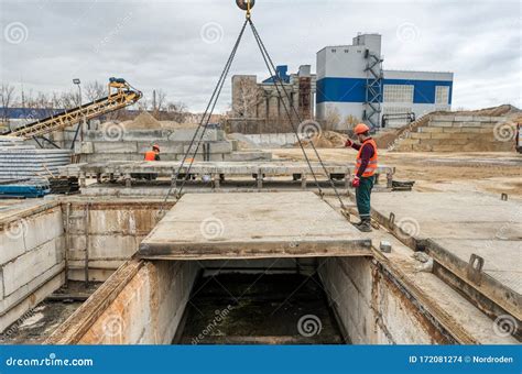 Lifting a Concrete Slab Using a Crane. Worker Controls the Lifting Process Editorial Stock Image ...