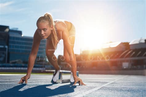 Professional female track athlete on sprinting blocks – Jacob Lund ...