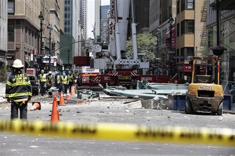 Crane accident in midtown Manhattan injures 10, damages high-rise building - LA Times