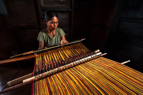 Traditional Loom Weaving. A kalinga woman in her home, making patterns ...