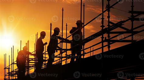 Construction workers on scaffold working in intense sunlight shadowed ...