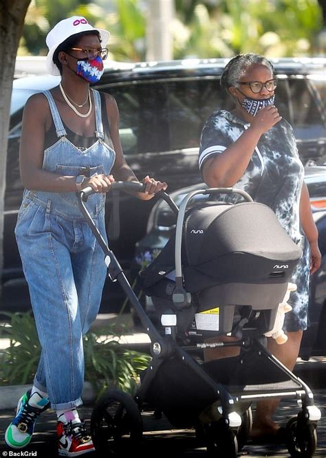 Jodie Turner-Smith keeps cool in denim dungarees on LA shopping trip with her mom and baby ...