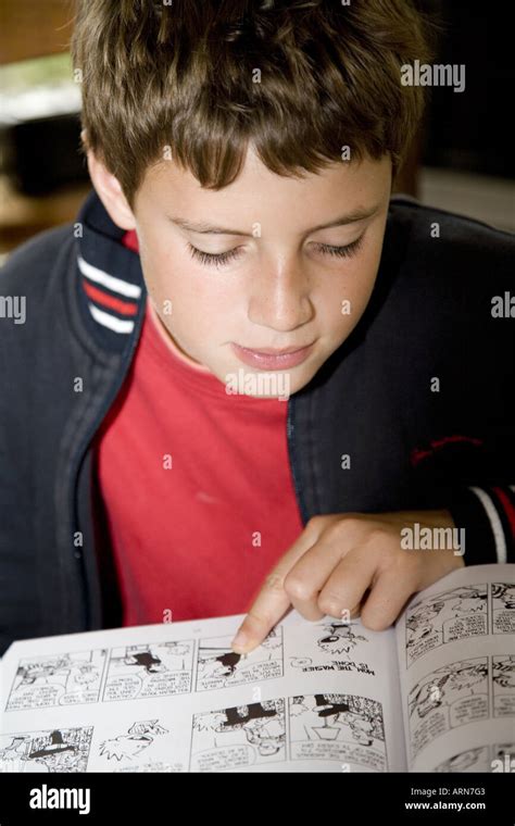 Young boy reading comic hi-res stock photography and images - Alamy