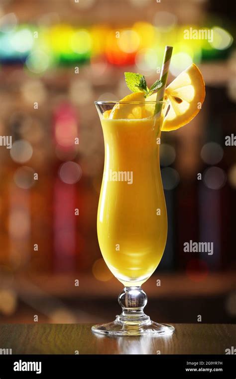 Glass of cocktail on bar background Stock Photo - Alamy