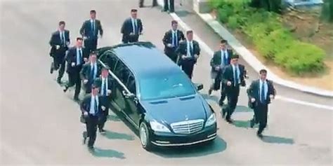 Kim Jong Un's bodyguards run beside his limo back into North Korea ...