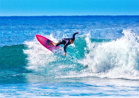 Surfer Surfing In Poipu Beach Kauaihawaii Stock Photo - Download Image Now - iStock