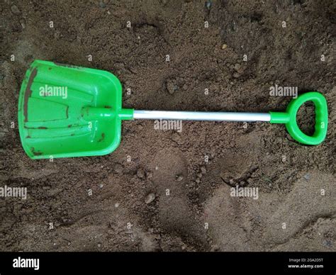 plastic shovel on the sand Stock Photo - Alamy