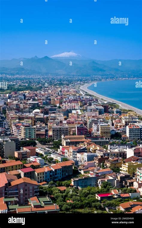 Aerial view of the city of Milazzo, located by the sea, and the volcano ...