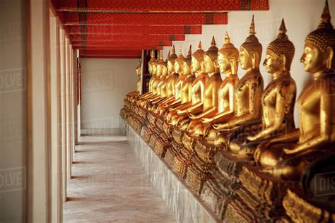 Seated Golden Buddha Statues In A Row At Wat Pho, Temple Of The ...