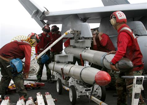 File:US Navy 030909-N-9907G-502 Weapons handlers, assigned to the Valions of Strike Fighter ...