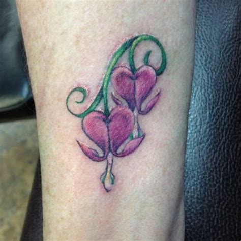 Bleeding hearts Bleeding heart flower and Types of flowers on ... | Flower wrist tattoos, Wrist ...