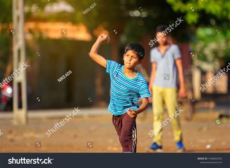 Rural Indian Child Playing Cricket Stock Photo (Edit Now) 1400842952