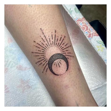 meaning of a solar eclipse tattoo - Google Search | Sun tattoo designs, Moon sun tattoo, Moon ...