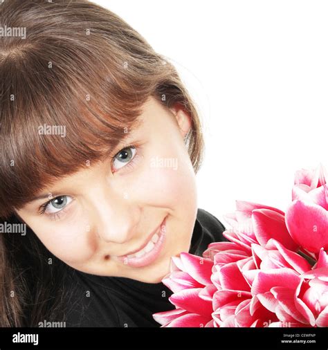 Smiling girl with flowers Stock Photo - Alamy