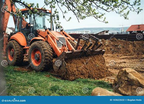 Heavy Duty Earth Moving Bulldozer Doing Landscaping and Moving Soil ...