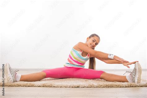 Beautiful teenage girl doing stretching exercises, Beautiful teen girl Physical exercise doing ...