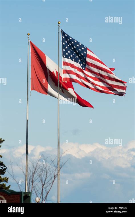 American canadian flag flying together hi-res stock photography and ...