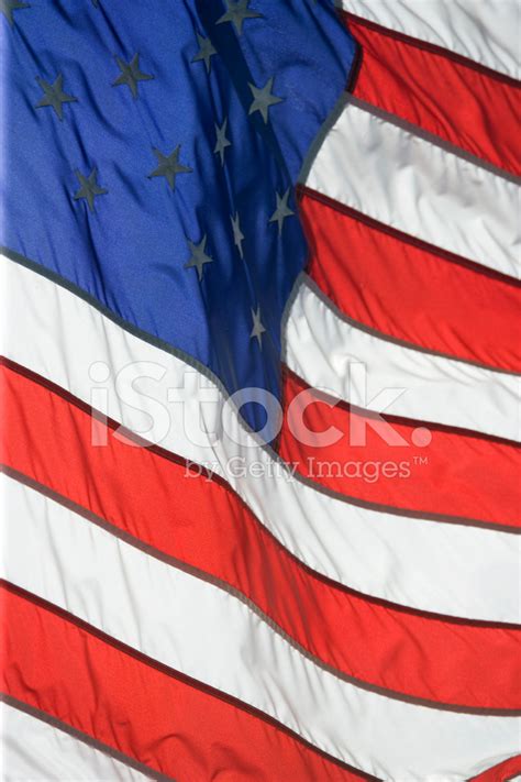 American Flag Flying Proudly On A Windy Day Stock Photo | Royalty-Free ...