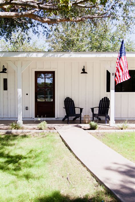 Batten board siding with barn light style sconces - by Rafterhouse | Ranch house exterior ...