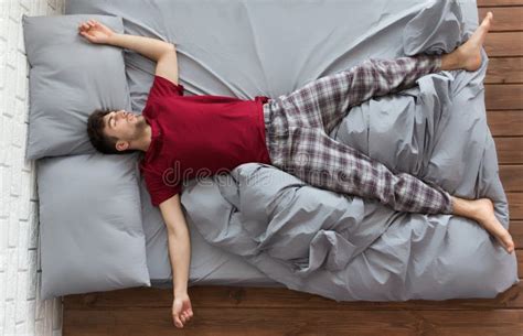 Man Sleeping in Bed at Home Stock Photo - Image of homely, comfortable: 124255396