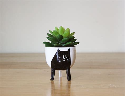 How cute is this handmade cat planter ? For the feline lovers in all of us, this piece would ...