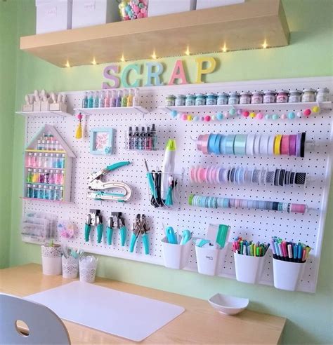 a craft room with pegboard and lots of craft supplies