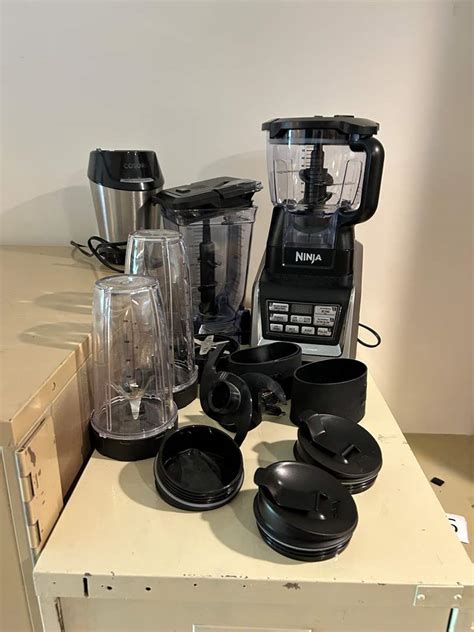 Lot #196 - Ninja Blender & Accessories - (Works) - Adam's Northwest ...