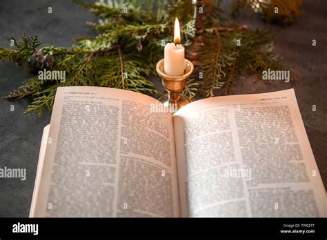 Open bible and candle hi-res stock photography and images - Alamy