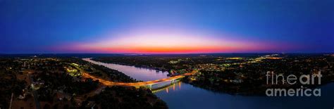 A gorgeous sunset falls on the bridge over Lake Marble Falls Photograph by Herronstock Prints ...