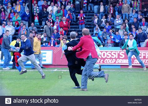 Fans fighting on the pitch at Selhurst Park after the match between ...