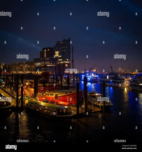 The illuminated port of Hamburg at night Stock Photo - Alamy